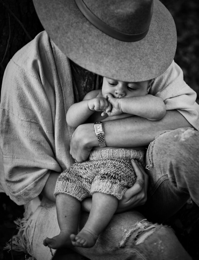 woman in hat hugging baby - Bisoux De Lune